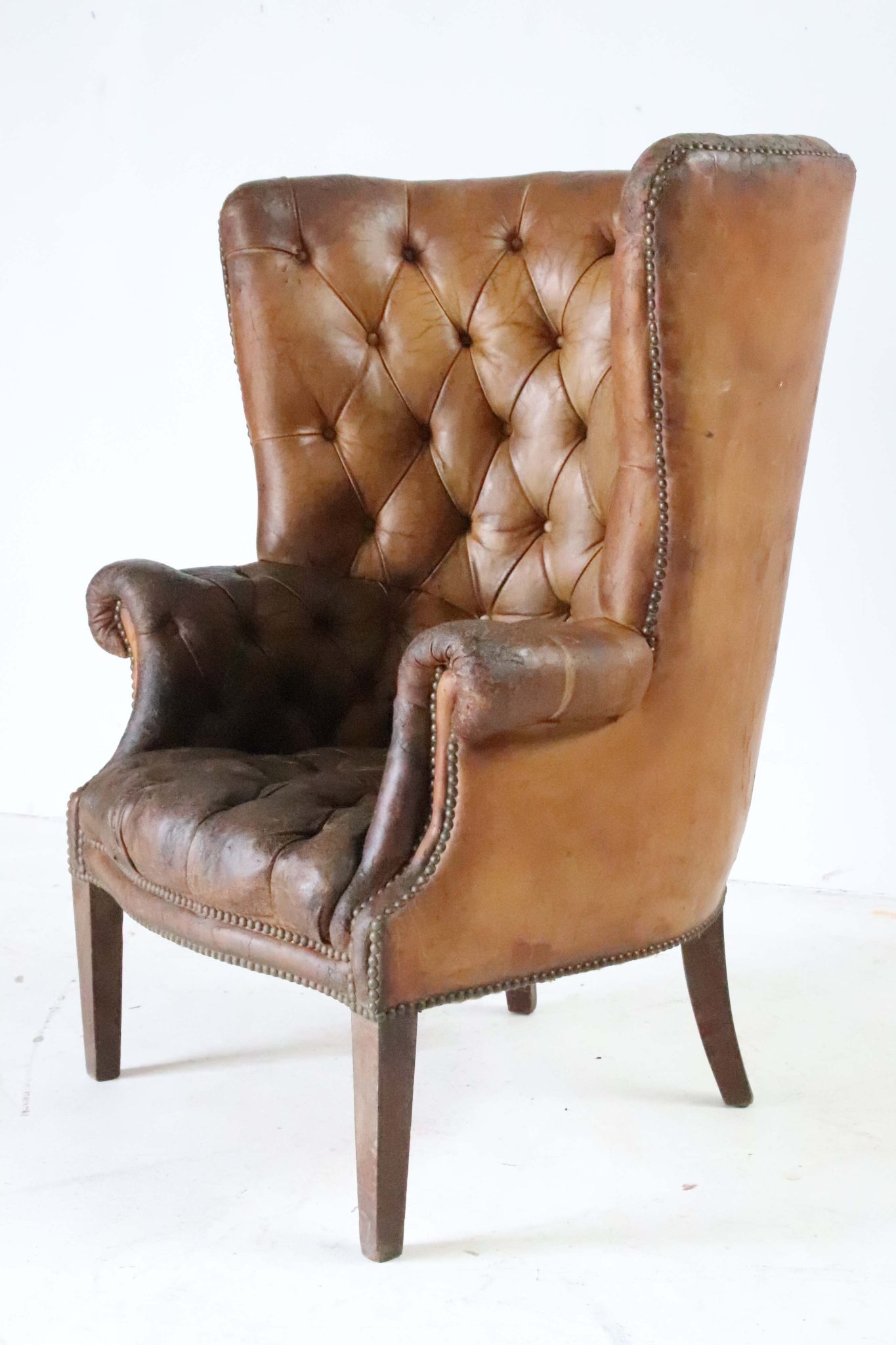 Edwardian Leather Barrel Back Arm Chair.